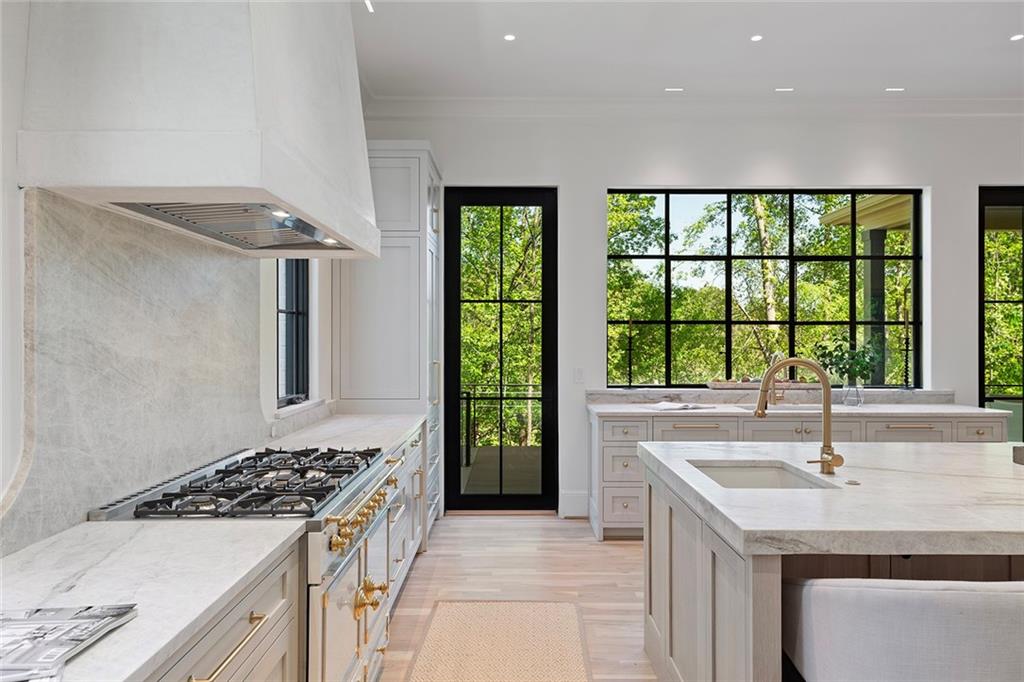 3290 Dunlop Court Atlanta, GA 30319 - Photo 27 of 81 a kitchen with a stove and a kitchen island