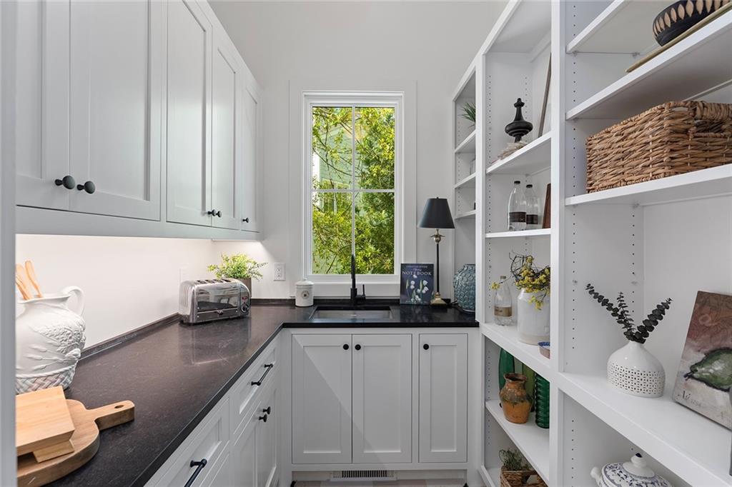 3290 Dunlop Court Atlanta, GA 30319 - Photo 29 of 81 a kitchen with sink a window and cabinets