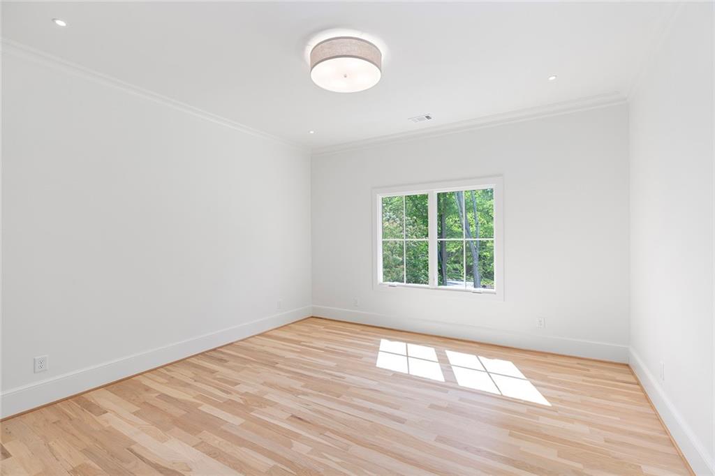 3290 Dunlop Court Atlanta, GA 30319 - Photo 33 of 81 an empty room with wooden floor and windows