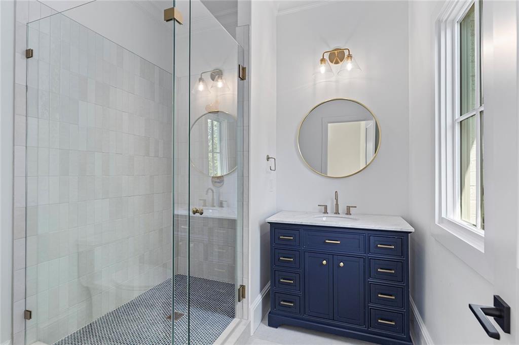 3290 Dunlop Court Atlanta, GA 30319 - Photo 34 of 81 a bathroom with a sink vanity granite and a mirror