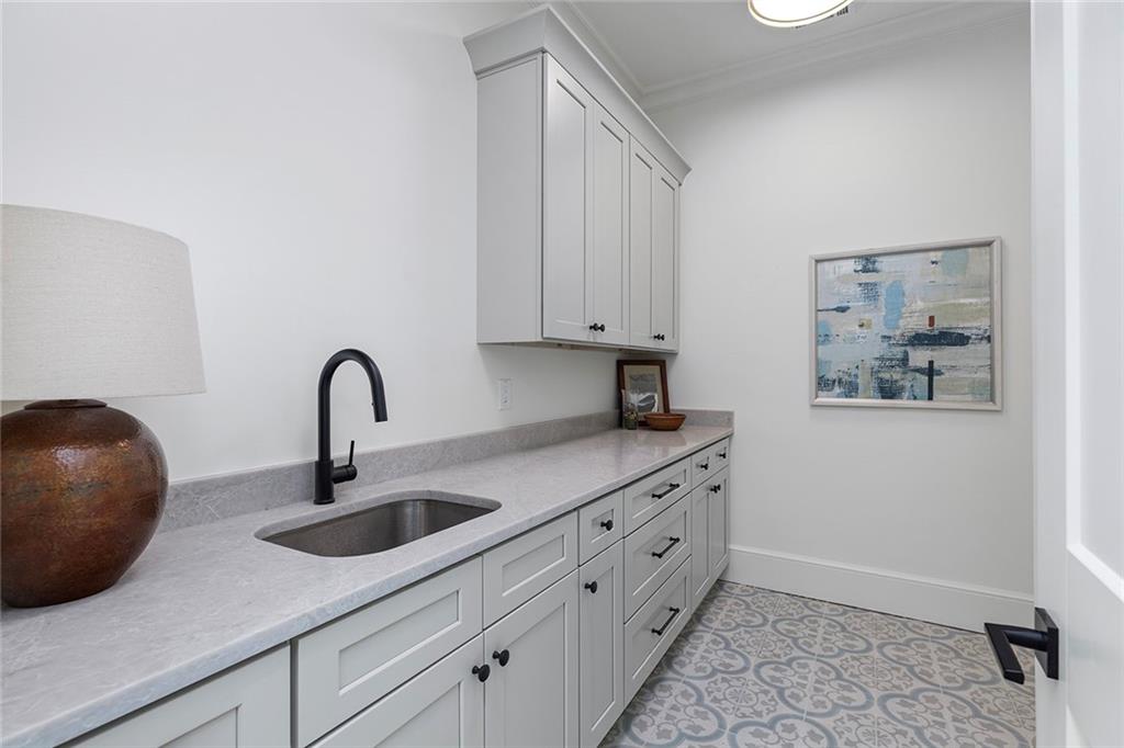 3290 Dunlop Court Atlanta, GA 30319 - Photo 39 of 81 a kitchen with stainless steel appliances granite countertop a sink and a white cabinets