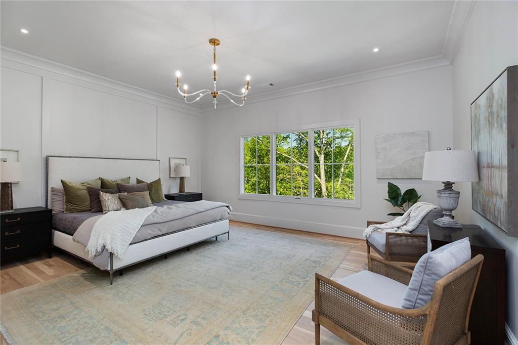 3290 Dunlop Court Atlanta, GA 30319 - Photo 40 of 81 a spacious bedroom with a bed and a couch