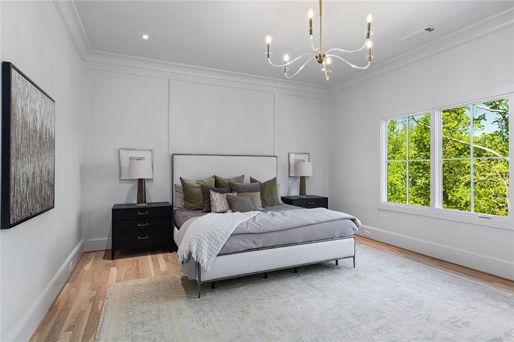 3290 Dunlop Court Atlanta, GA 30319 - Photo 41 of 81 a spacious bedroom with a bed window and couch