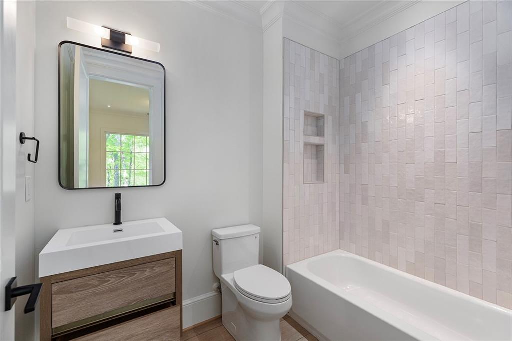 3290 Dunlop Court Atlanta, GA 30319 - Photo 54 of 81 a bathroom with a sink a toilet and shower