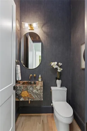 a living room with fireplace furniture and a large window