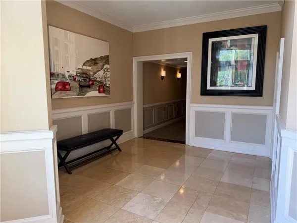 a view of a livingroom with furniture and a ceiling fan