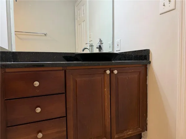 a close up of a sink and a mirror