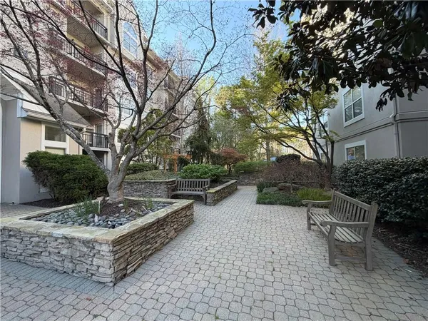 a view of a chairs and fire pit in a patio