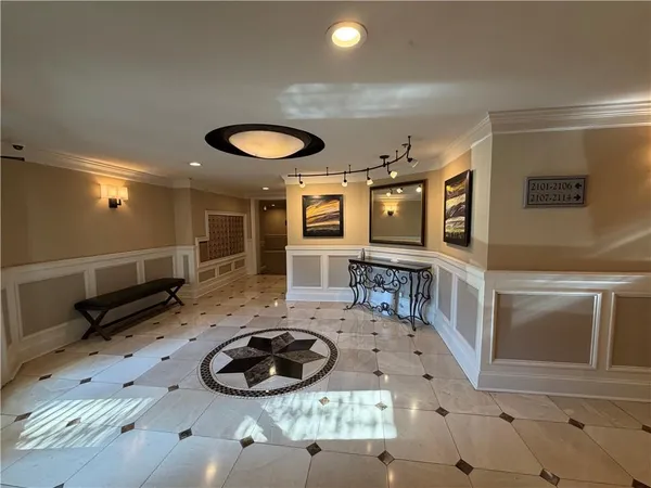 a room with furniture and a flat screen tv