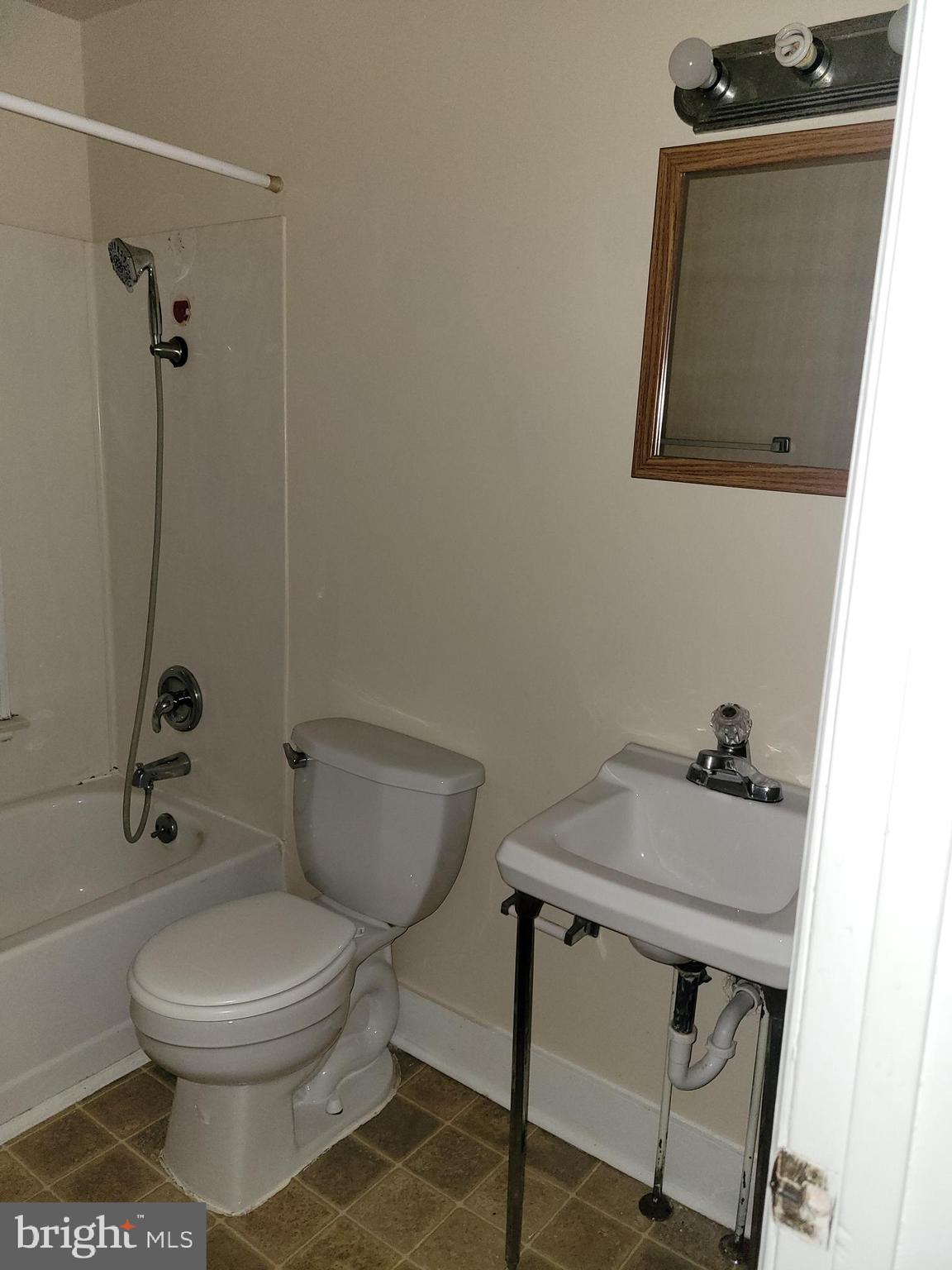 201 East Franklin Street, Unit 6 Hagerstown, MD 21740 - Photo 4 of 9 a bathroom with a toilet and a sink
