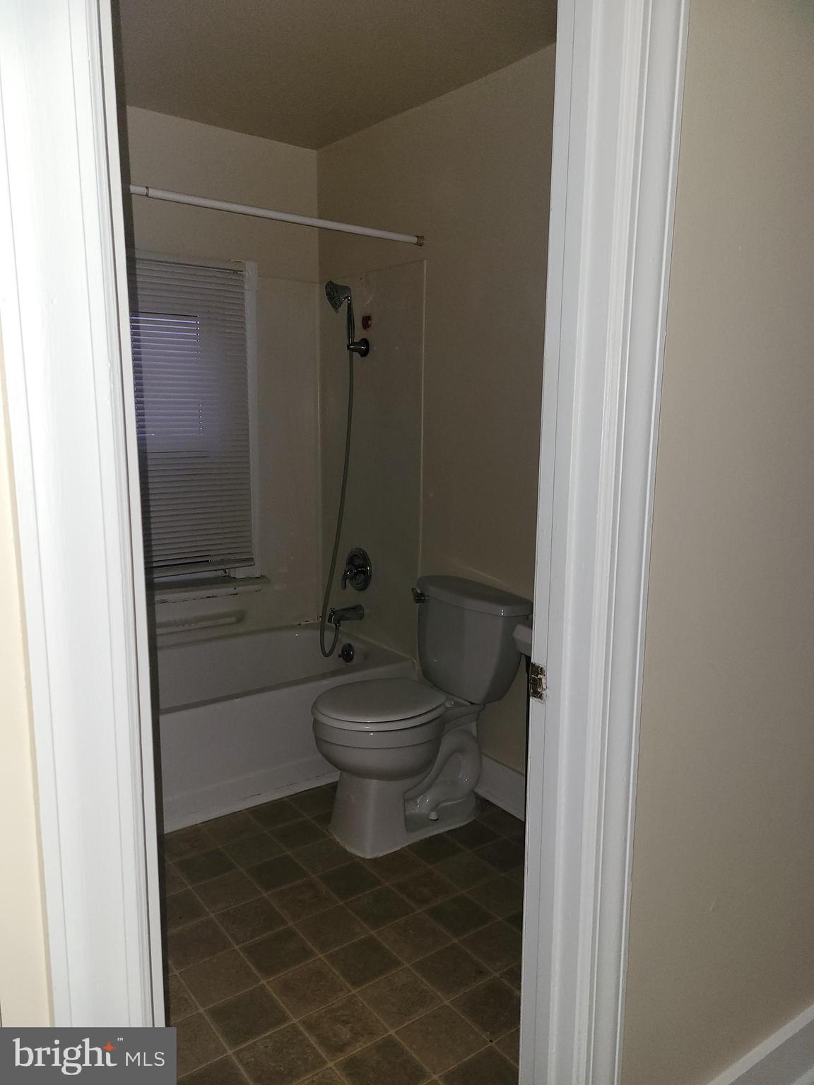 201 East Franklin Street, Unit 6 Hagerstown, MD 21740 - Photo 9 of 9 a bathroom with a toilet and a shower