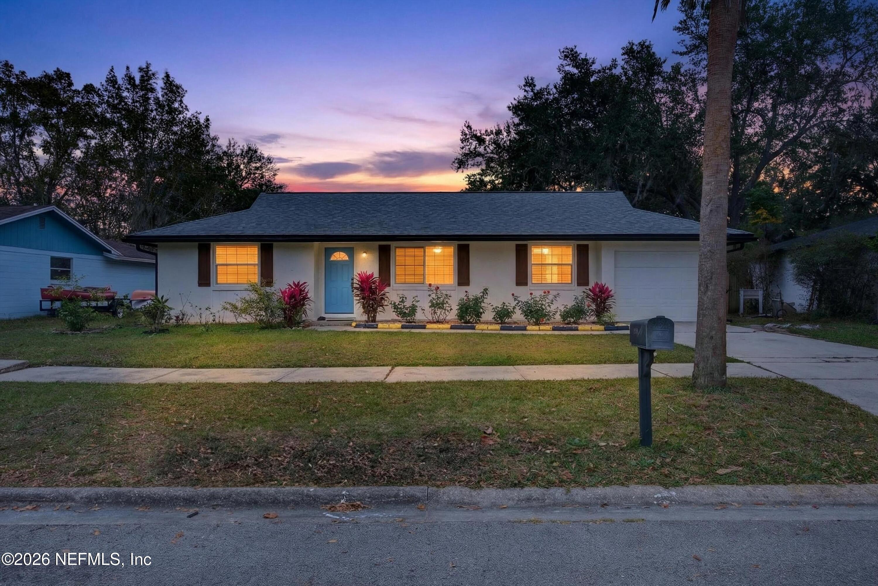a front view of a house with a yard