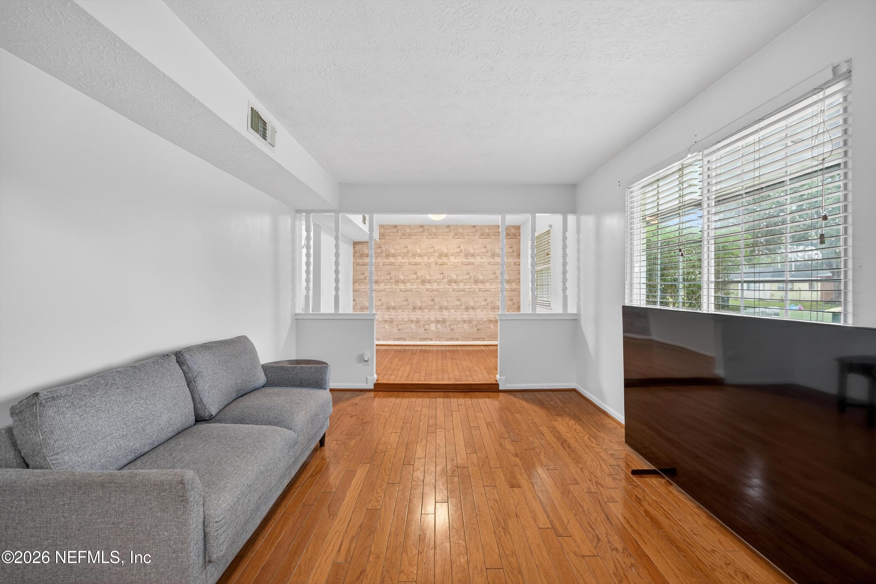 3570 Grassy Ride Drive Jacksonville, FL 32223 - Photo 10 of 51 a living room with furniture and a large window
