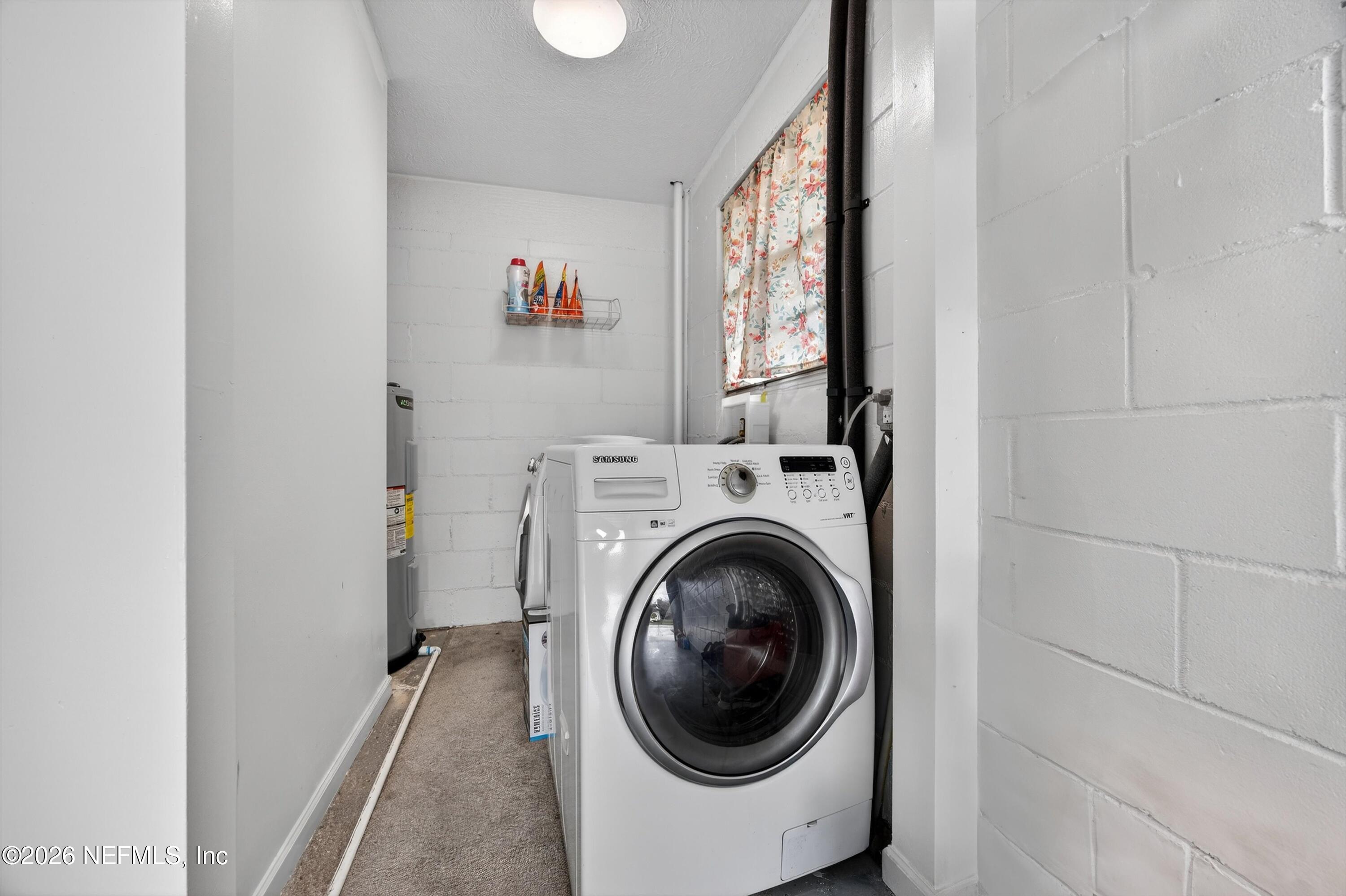 3570 Grassy Ride Drive Jacksonville, FL 32223 - Photo 32 of 51 a view of a hallway with washer and dryer