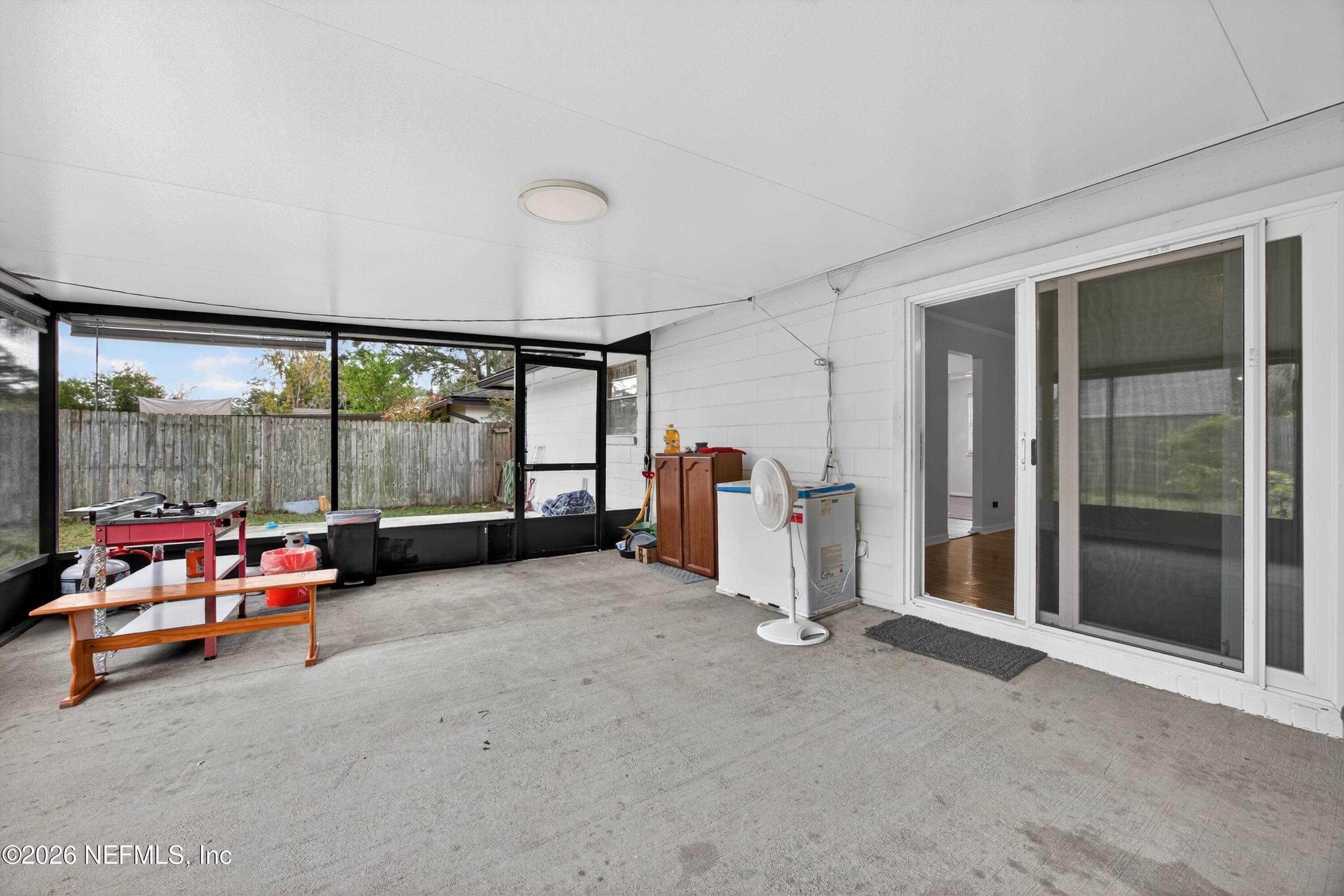 3570 Grassy Ride Drive Jacksonville, FL 32223 - Photo 34 of 51 an empty room with sliding door and mountain view