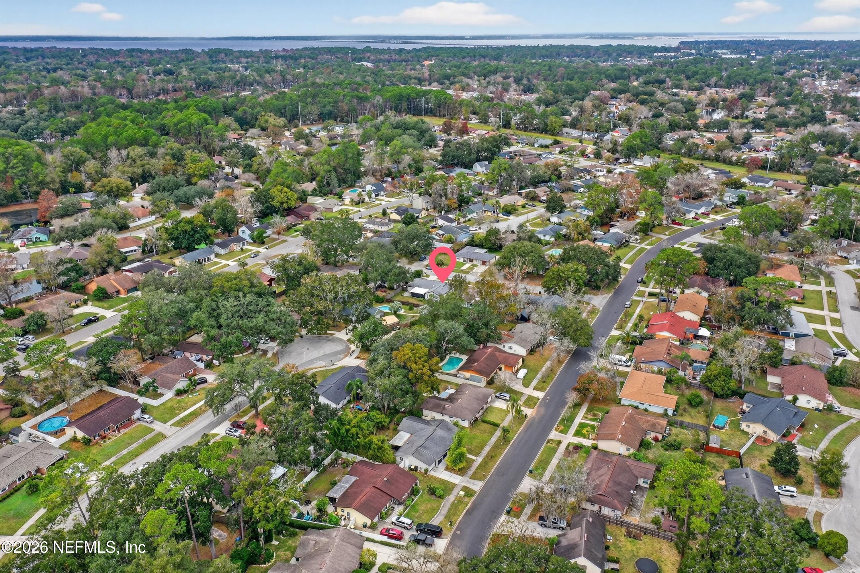3570 Grassy Ride Drive Jacksonville, FL 32223 - Photo 37 of 51 an aerial view of residential houses with outdoor space and covered with tall trees