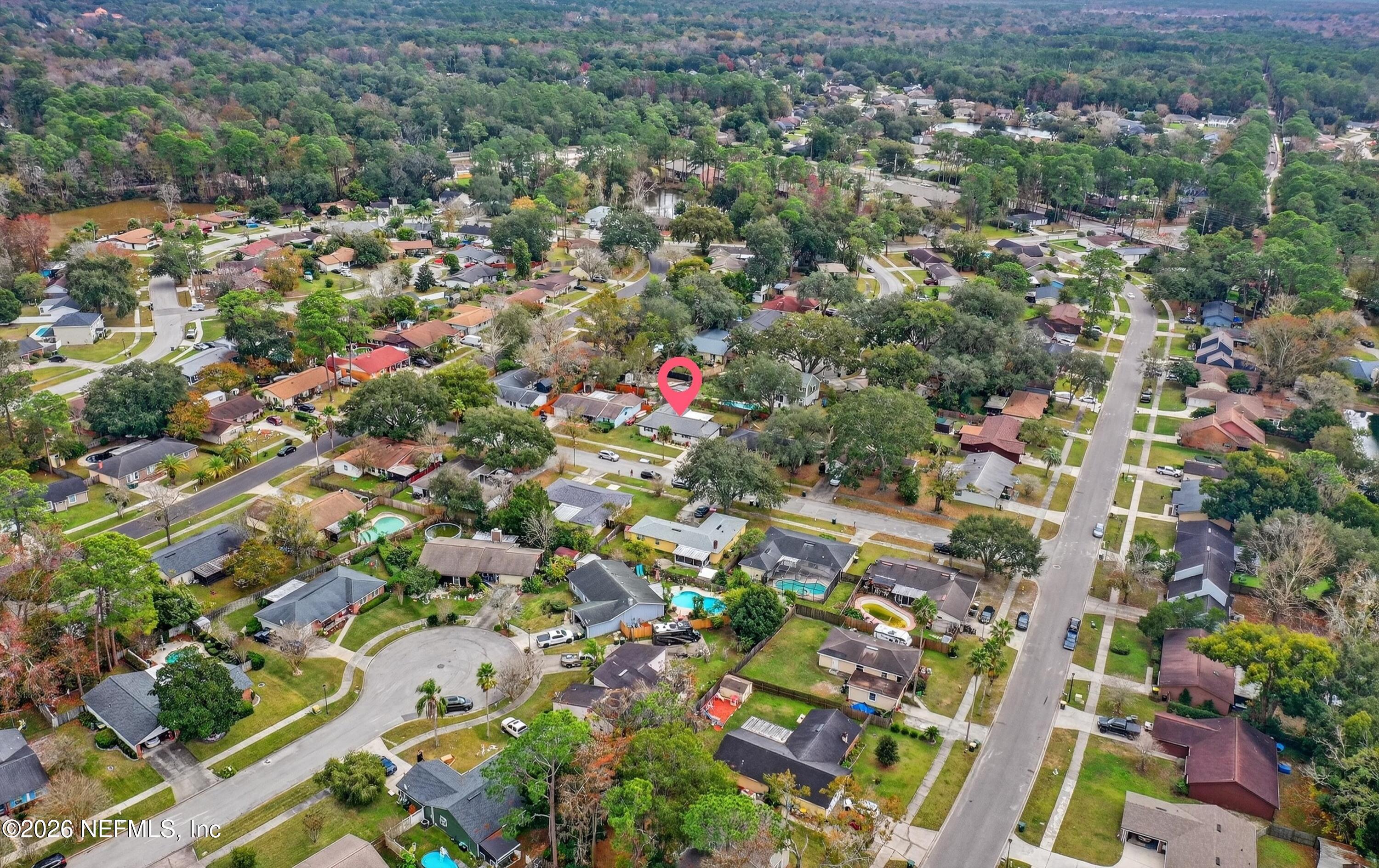 3570 Grassy Ride Drive Jacksonville, FL 32223 - Photo 42 of 51 an aerial view of residential houses with outdoor space and trees