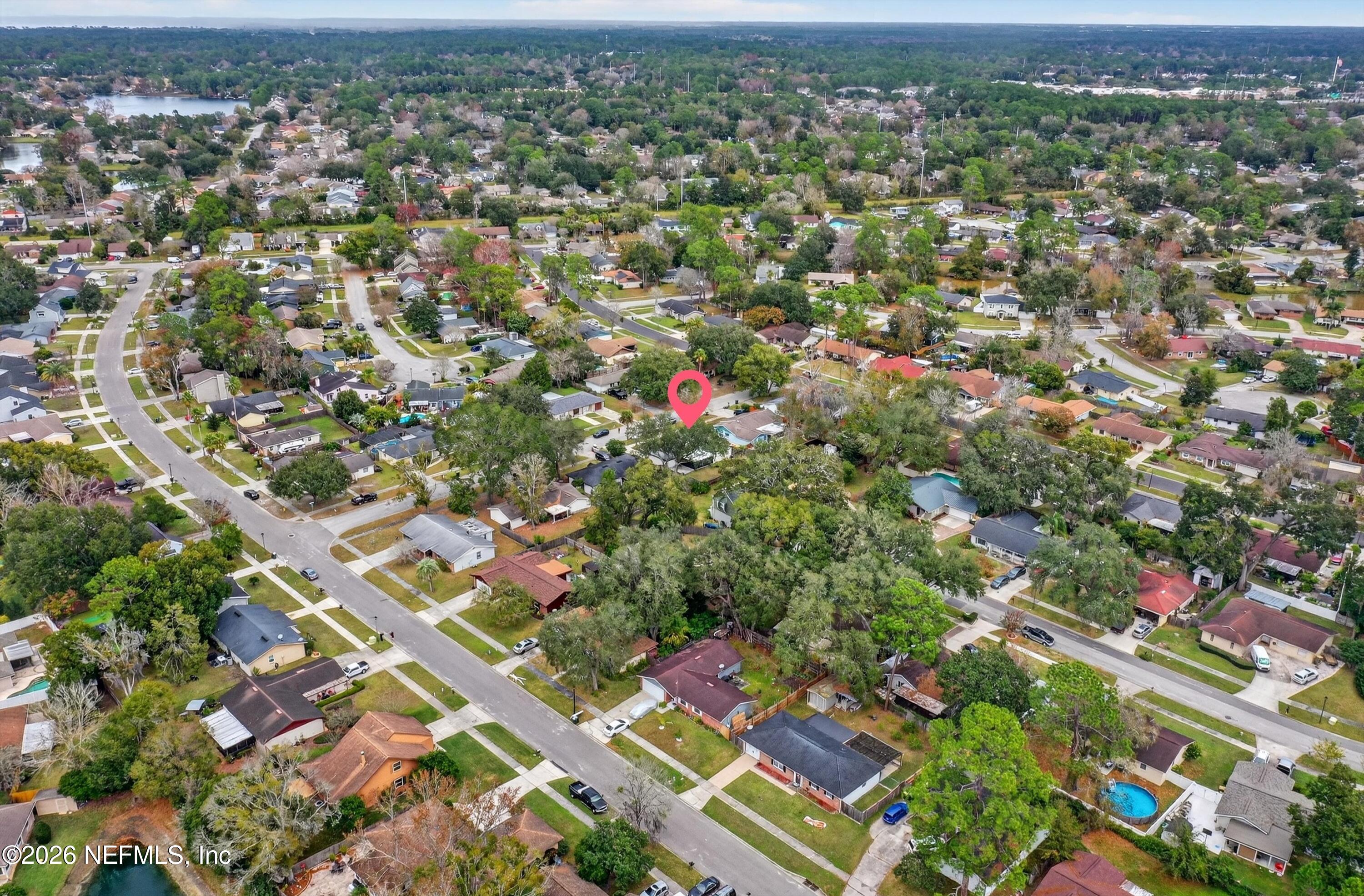 3570 Grassy Ride Drive Jacksonville, FL 32223 - Photo 49 of 51 an aerial view of residential houses with outdoor space