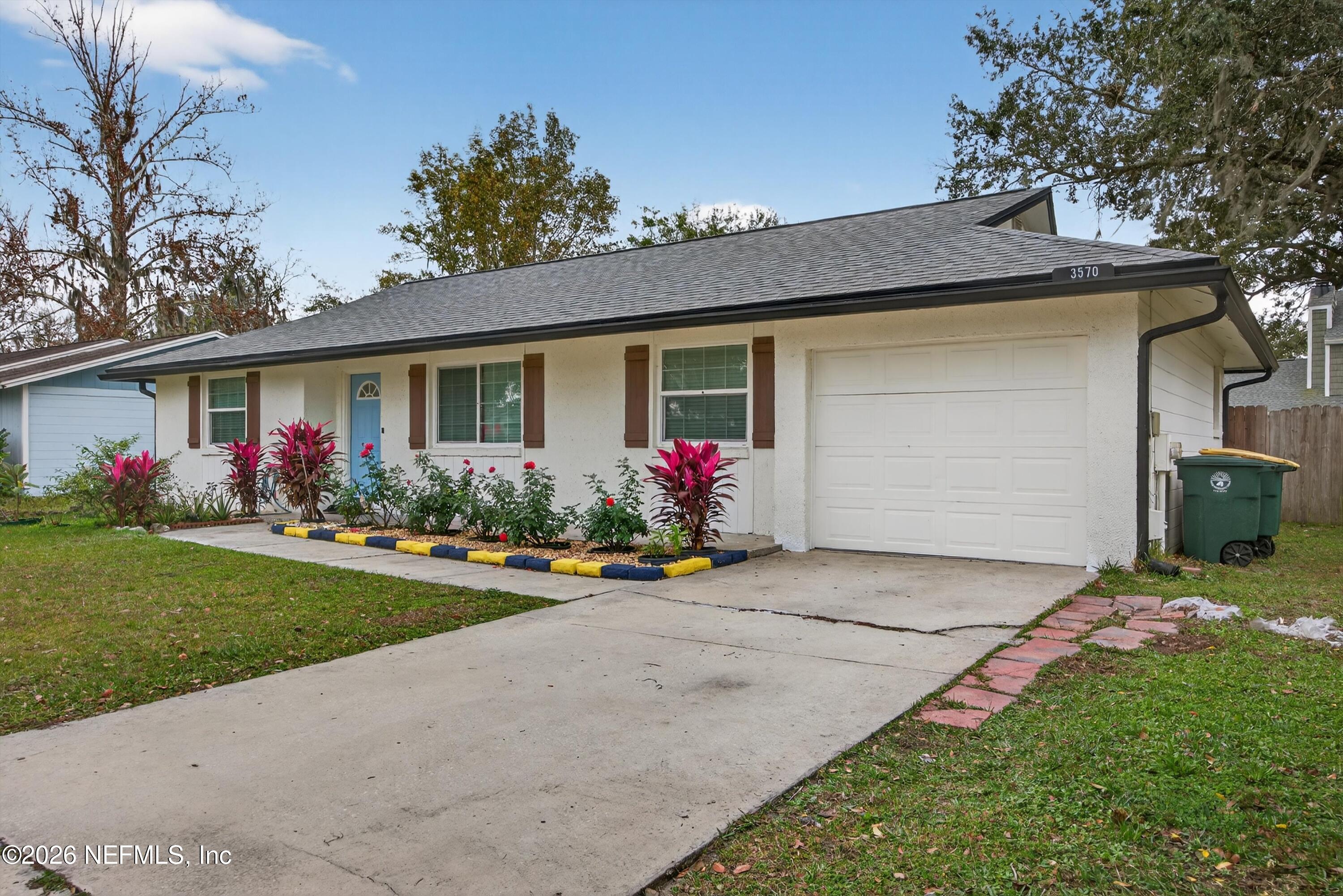 3570 Grassy Ride Drive Jacksonville, FL 32223 - Photo 5 of 51 a front view of house with yard
