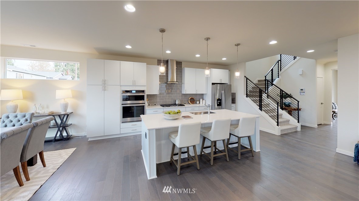 3129 193rd Place Southeast Bothell, WA 98012 - Photo 5 of 9 a large kitchen with a table and chairs