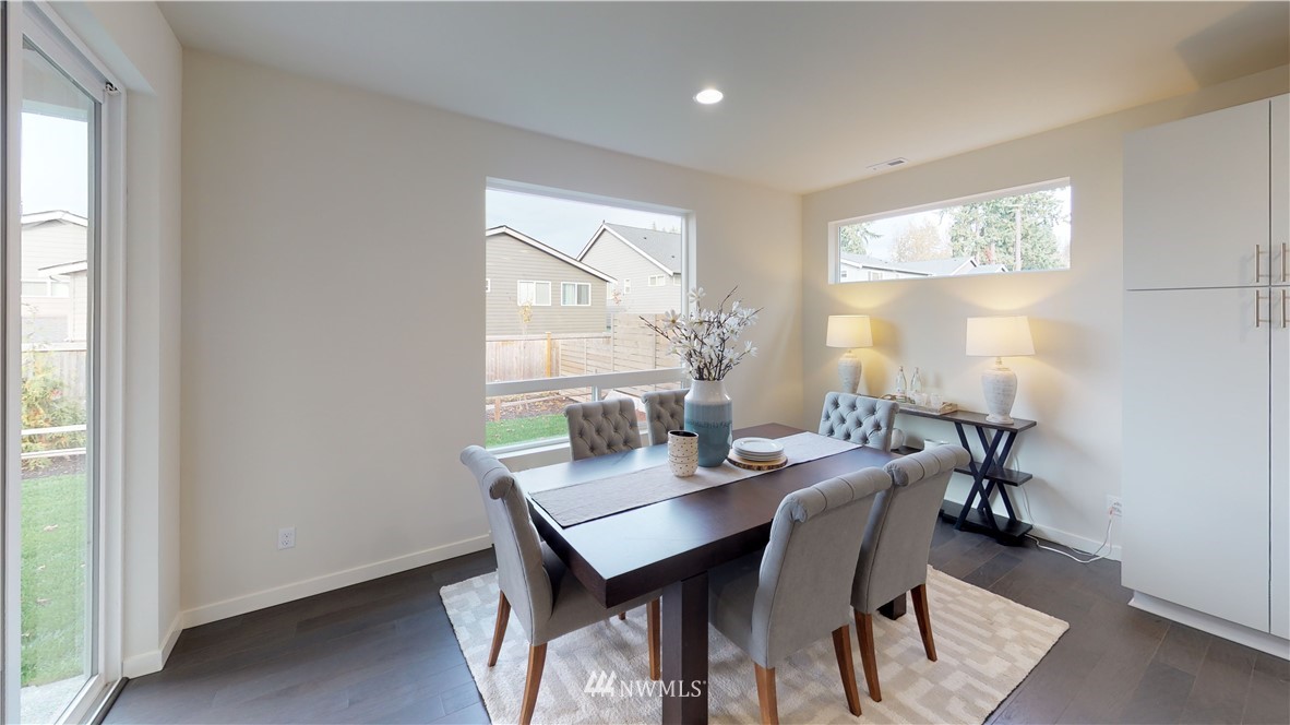 3129 193rd Place Southeast Bothell, WA 98012 - Photo 6 of 9 a view of a dining room with furniture and window
