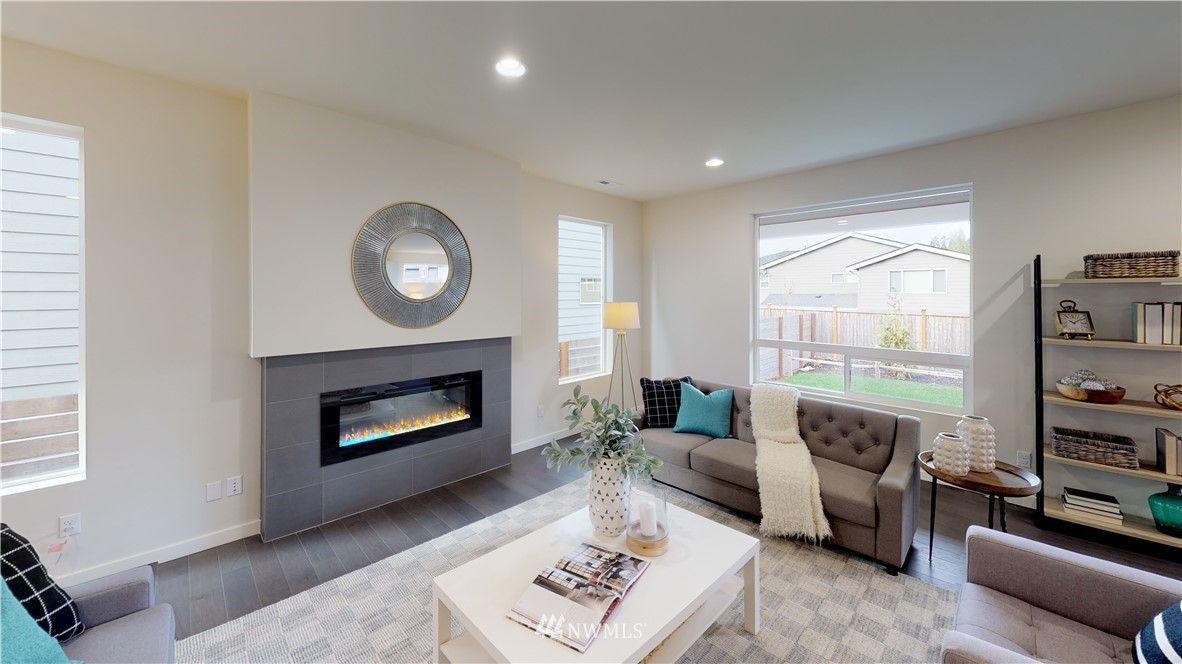 3129 193rd Place Southeast Bothell, WA 98012 - Photo 7 of 9 a living room with furniture and a fireplace