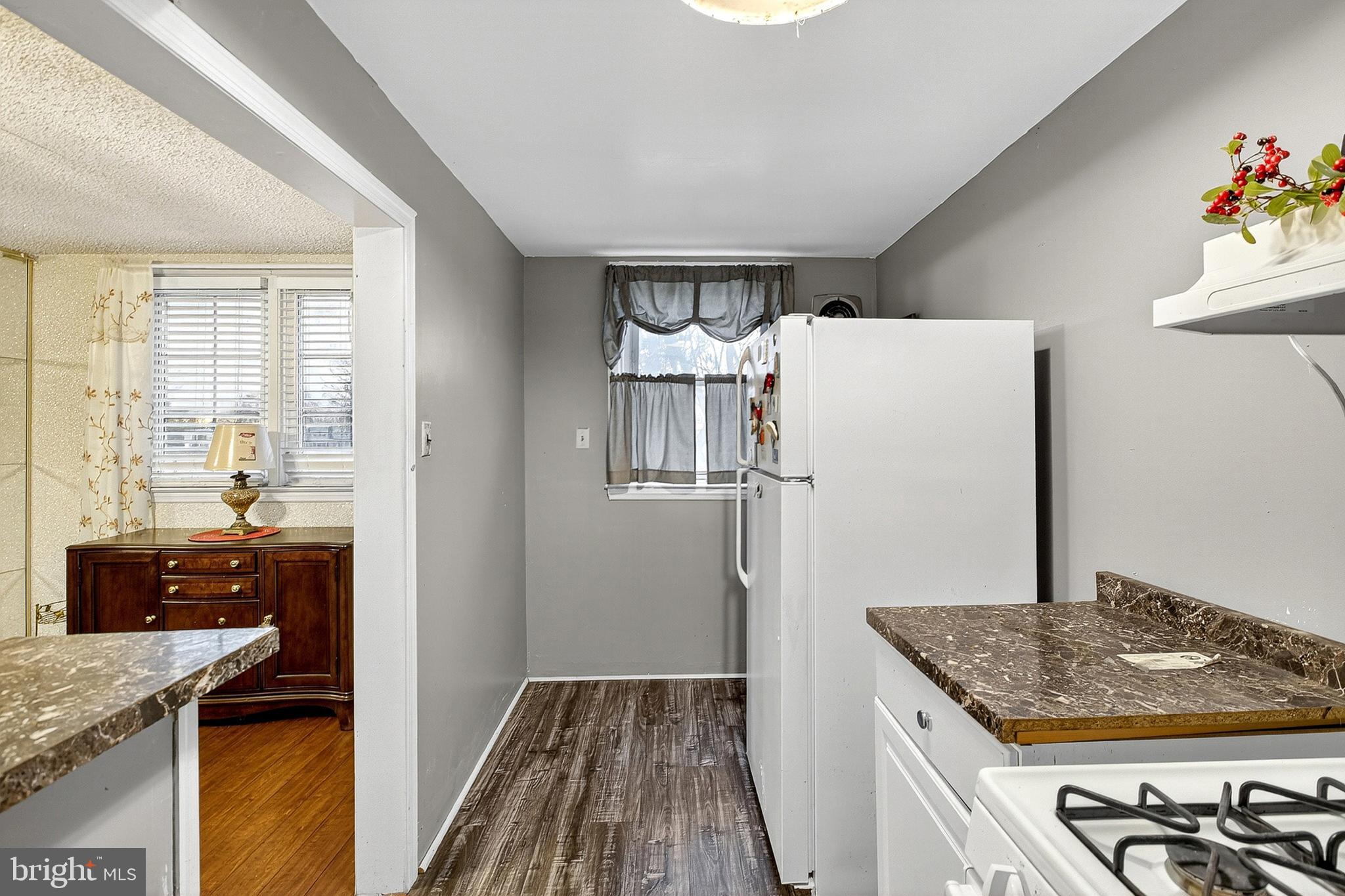 252 North 9th Street Darby, PA 19023 - Photo 13 of 22 a kitchen with a refrigerator and a stove