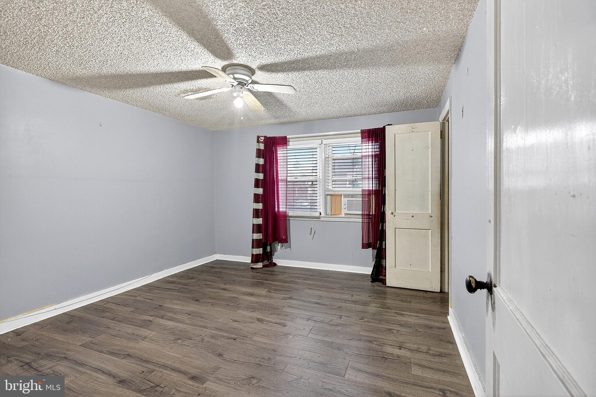 252 North 9th Street Darby, PA 19023 - Photo 19 of 22 wooden floor in an empty room with a window