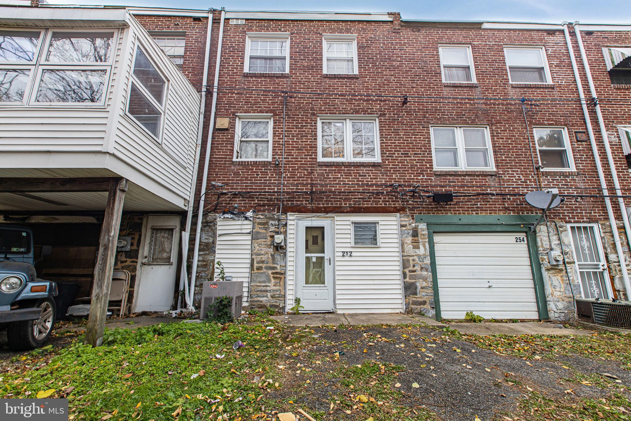 252 North 9th Street Darby, PA 19023 - Photo 21 of 22 a front view of a house with a yard