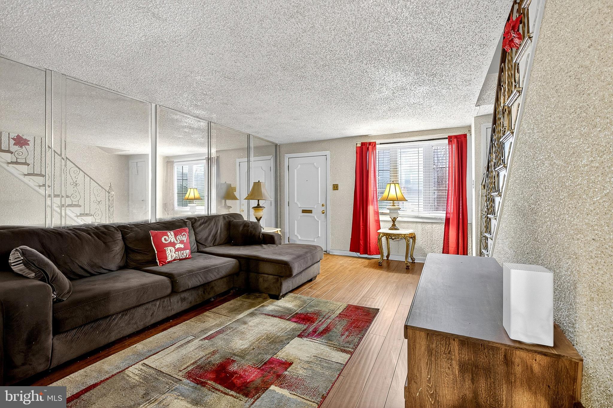252 North 9th Street Darby, PA 19023 - Photo 7 of 22 a living room with furniture and a wooden floor