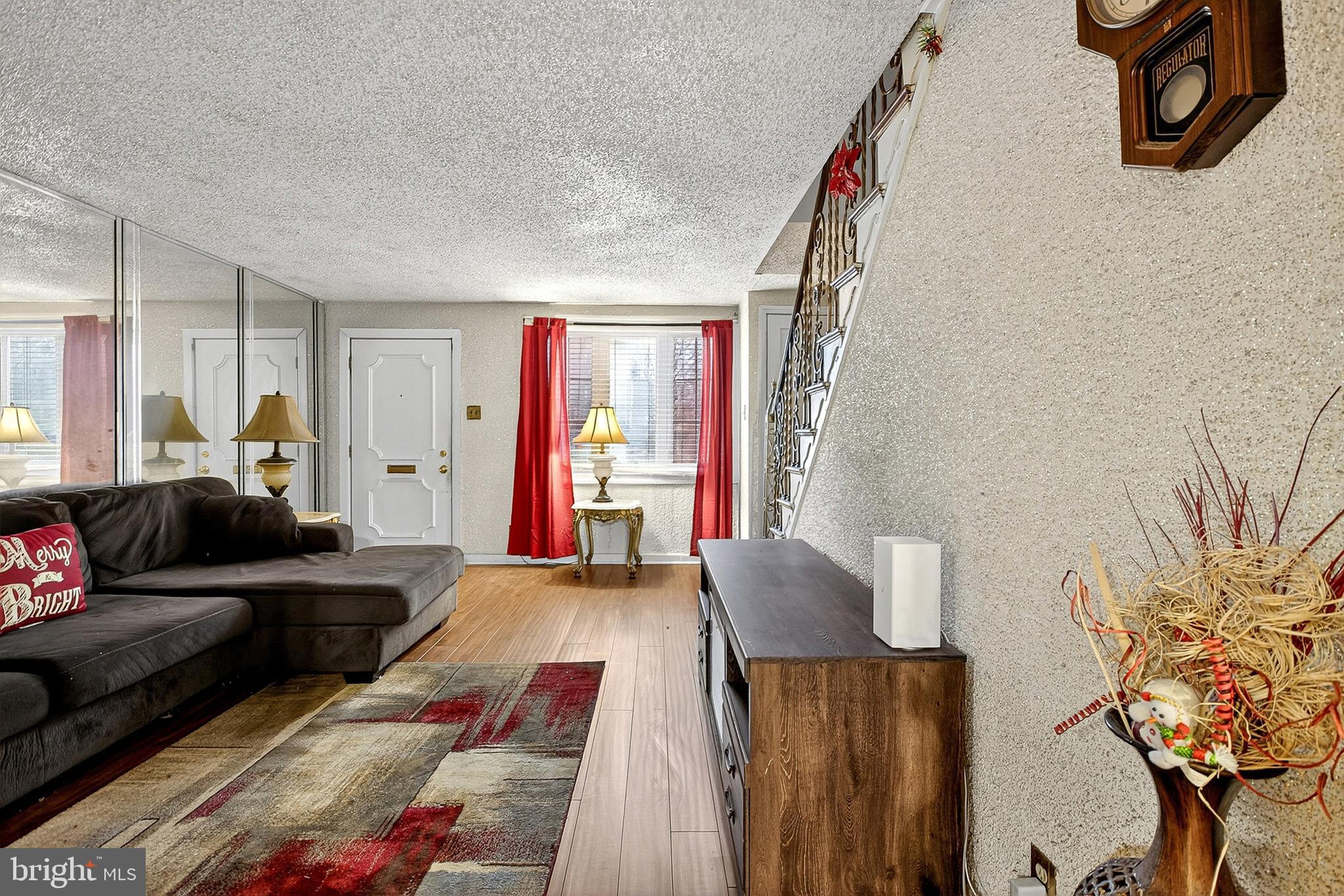 252 North 9th Street Darby, PA 19023 - Photo 8 of 22 a living room with furniture and a potted plant