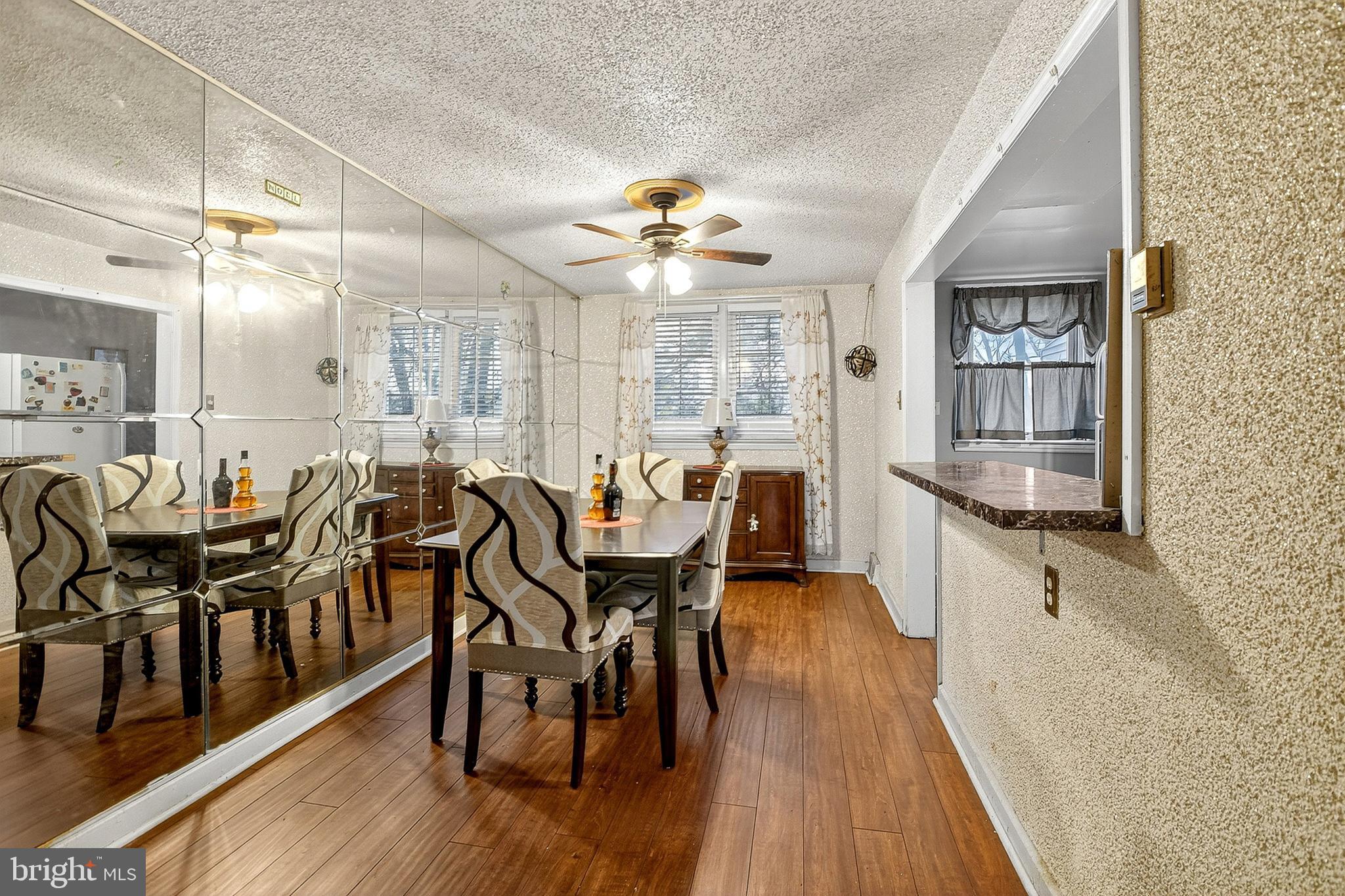 252 North 9th Street Darby, PA 19023 - Photo 9 of 22 a very nice looking dining room with kitchen island a large window and stainless steel appliances