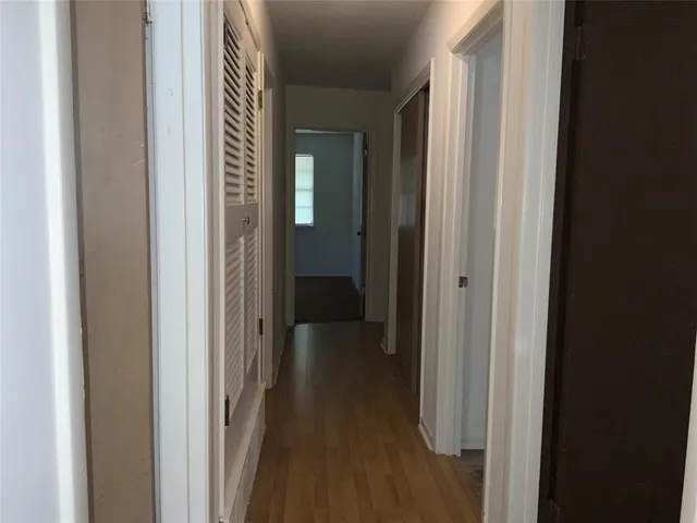 an empty room with a empty space and windows