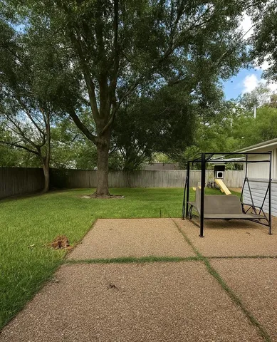a view of backyard with green space