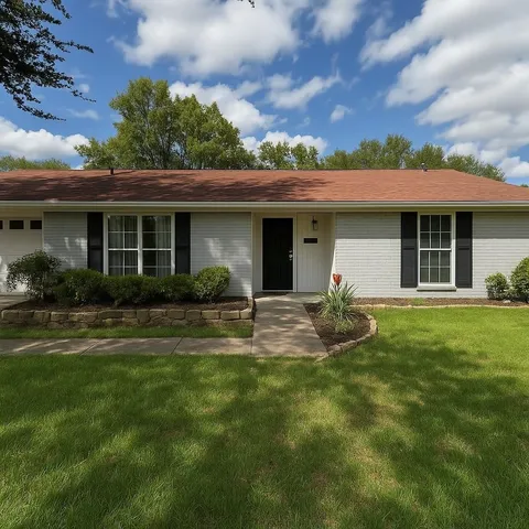 a view of a house with a backyard