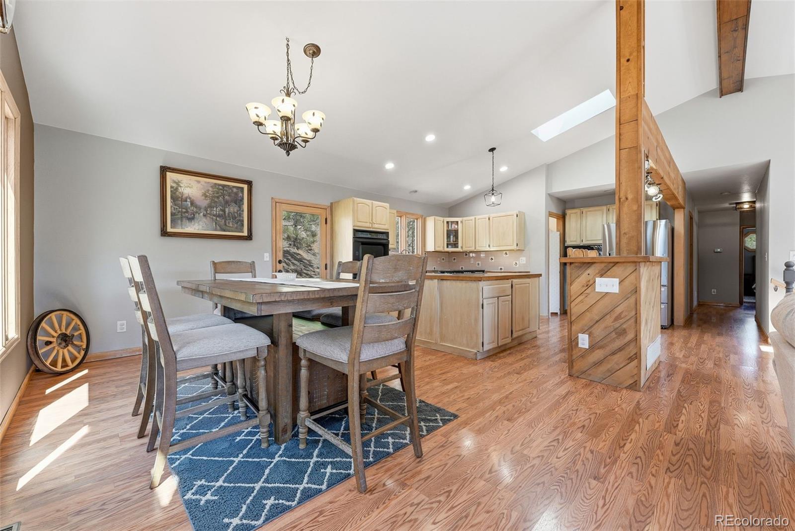 16687 Ouray Road West Pine, CO 80470 - Photo 12 of 49 a view of a dining room with furniture and wooden floor