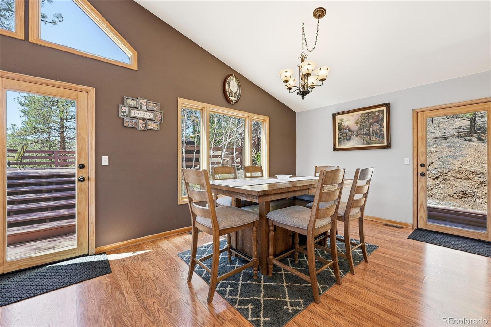 16687 Ouray Road West Pine, CO 80470 - Photo 13 of 49 a view of a dining room with furniture window and wooden floor