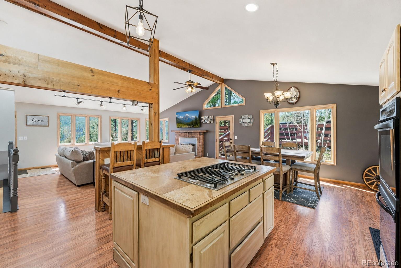 16687 Ouray Road West Pine, CO 80470 - Photo 16 of 49 a open kitchen with stainless steel appliances granite countertop a stove and refrigerator
