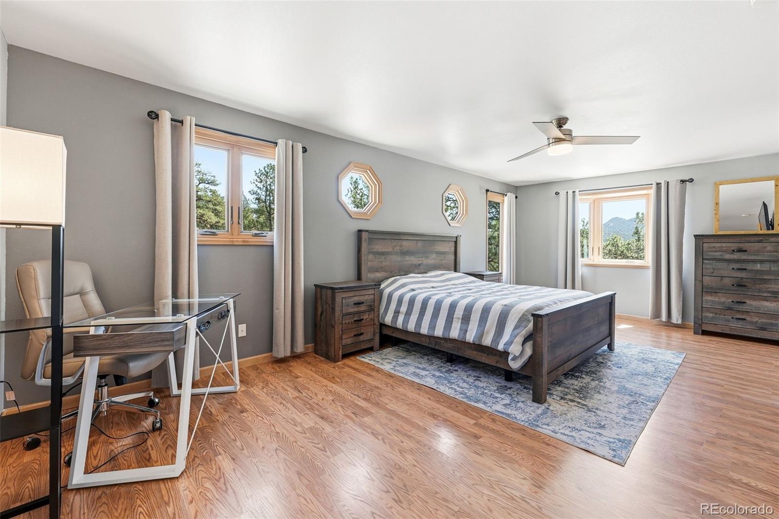 16687 Ouray Road West Pine, CO 80470 - Photo 21 of 49 a bedroom with a bed and a table in it