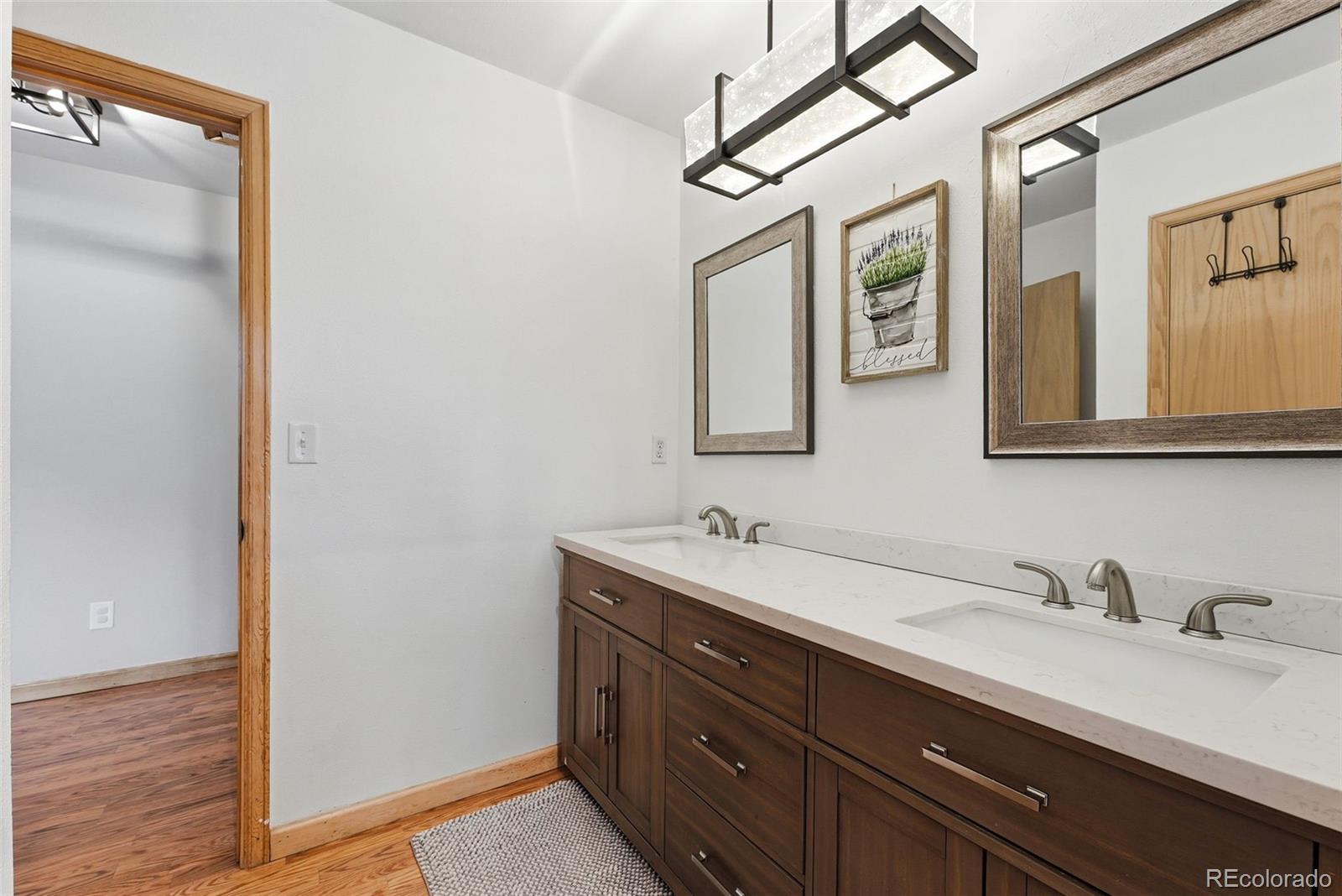 16687 Ouray Road West Pine, CO 80470 - Photo 28 of 49 a bathroom with a sink and a mirror