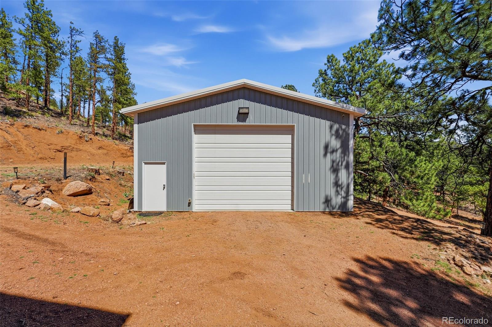 16687 Ouray Road West Pine, CO 80470 - Photo 33 of 49 a front view of a house with a yard