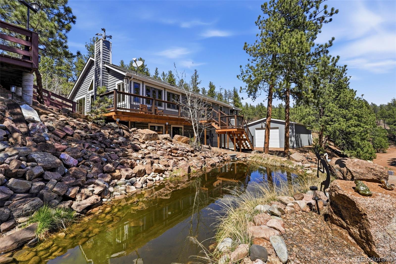 16687 Ouray Road West Pine, CO 80470 - Photo 41 of 49 a view of a house with a yard and sitting area