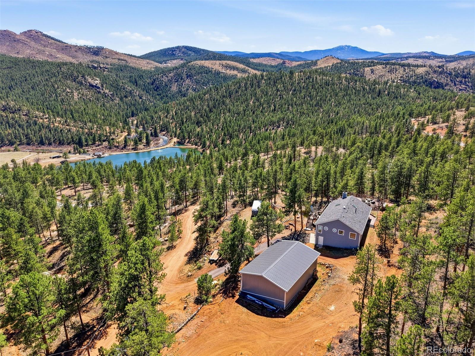 16687 Ouray Road West Pine, CO 80470 - Photo 42 of 49 a view of a lush green hillside and houses