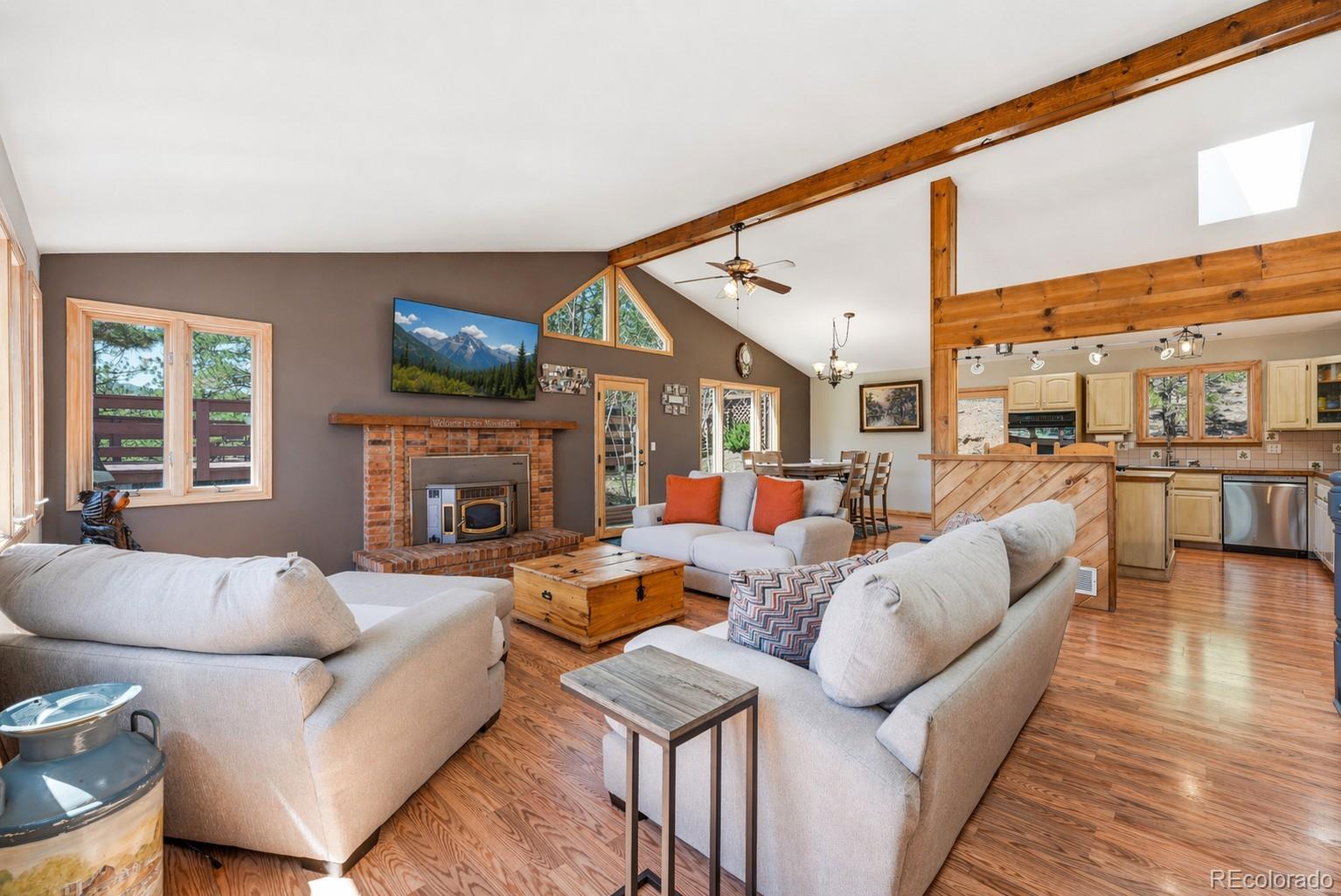 16687 Ouray Road West Pine, CO 80470 - Photo 6 of 49 a living room with furniture fireplace and a large window
