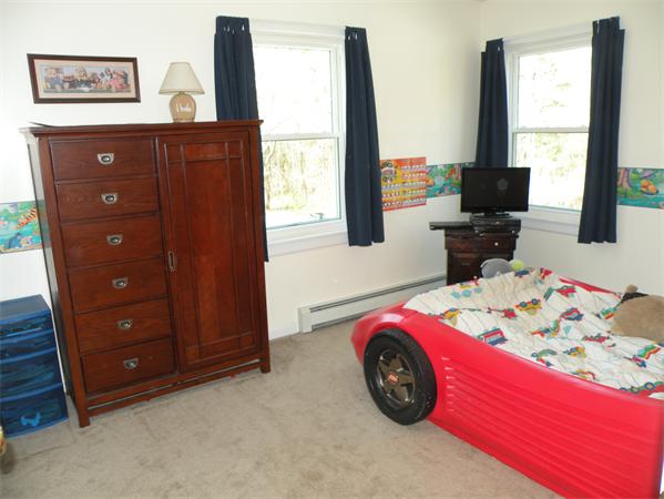 35 Kruse Road Hubbardston, MA 01452 - Photo 21 of 29 a bedroom with a bed and a window