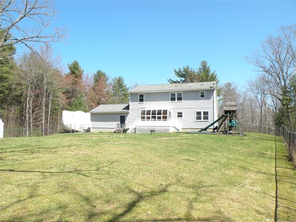 35 Kruse Road Hubbardston, MA 01452 - Photo 26 of 29 a house with trees in front of it