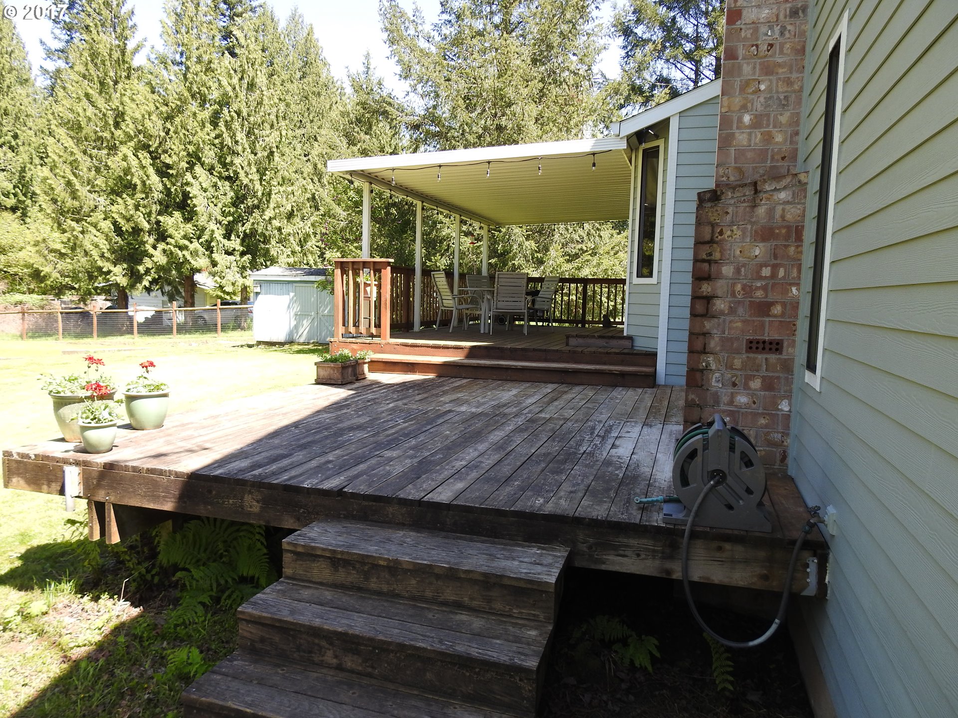 19637 Southeast Heuke Road Damascus, OR 97089 - Photo 11 of 14 a view of a house with backyard and sitting area