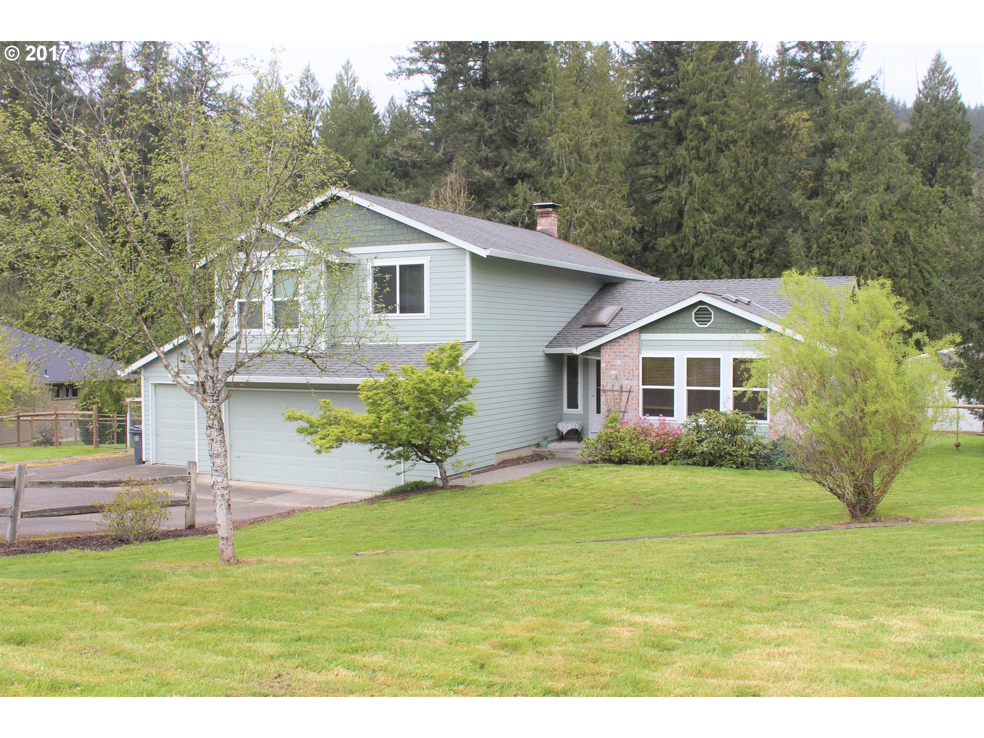 19637 Southeast Heuke Road Damascus, OR 97089 - Photo 13 of 14 a front view of a house with a yard