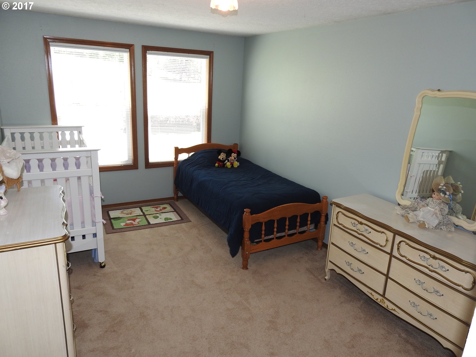 19637 Southeast Heuke Road Damascus, OR 97089 - Photo 10 of 14 a bed room with a bed and a window