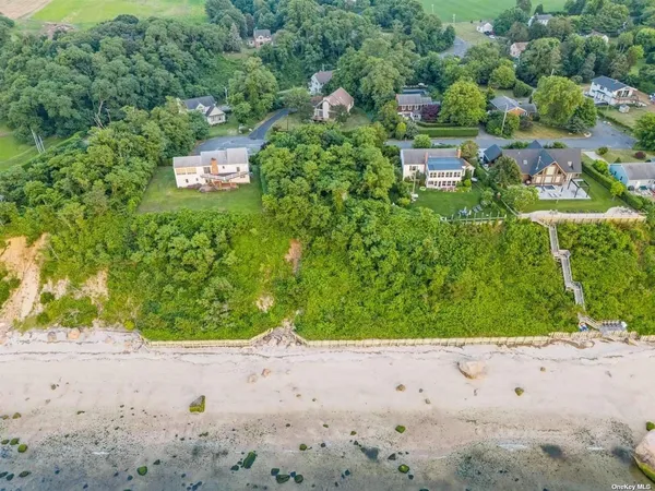 a view of a big yard with a house in the background